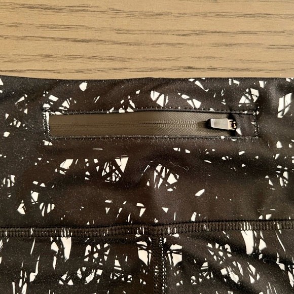 Black and white patterned active leggings! Zipper pocket on back waist. Size M. - Picture 3 of 3